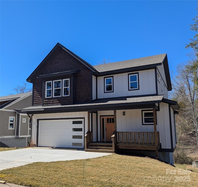 view of front of property with a front yard, a porch, an attached garage, concrete driveway, and board and batten siding