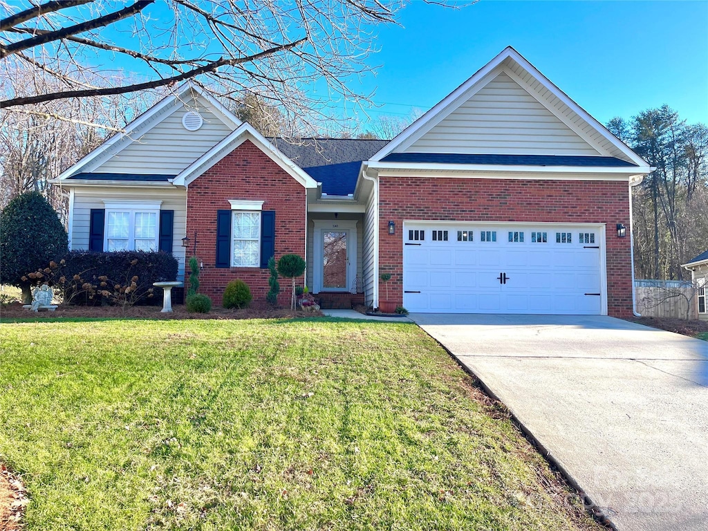 single story home with a front yard and a garage