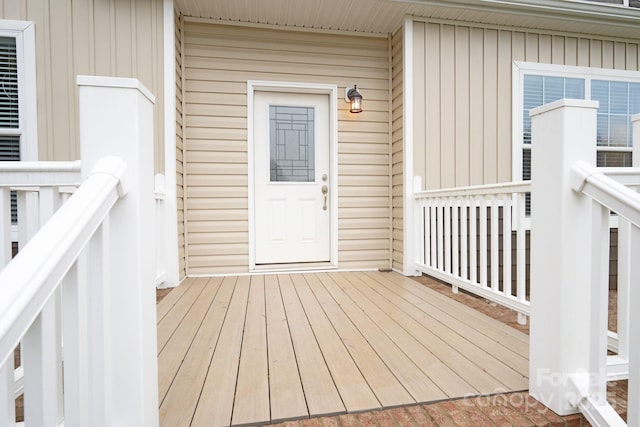 property entrance with a wooden deck