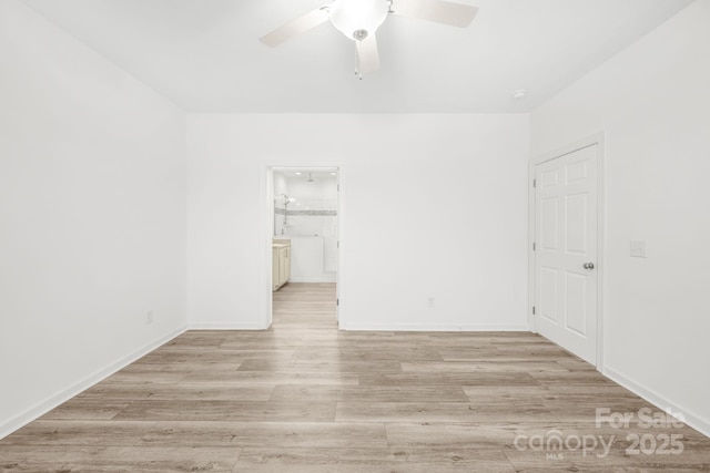 unfurnished room featuring ceiling fan and light hardwood / wood-style floors