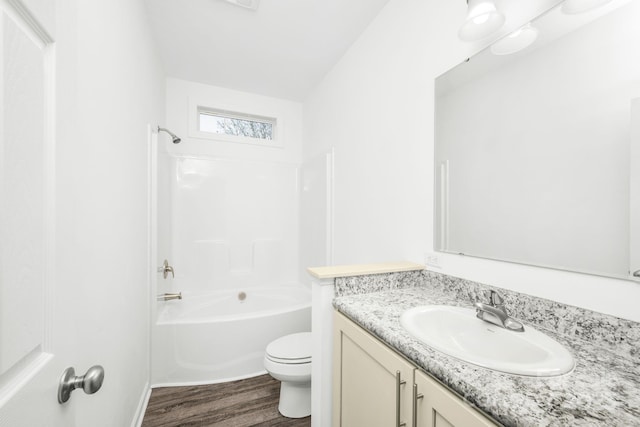 full bathroom with vanity, vaulted ceiling, shower / tub combination, wood-type flooring, and toilet