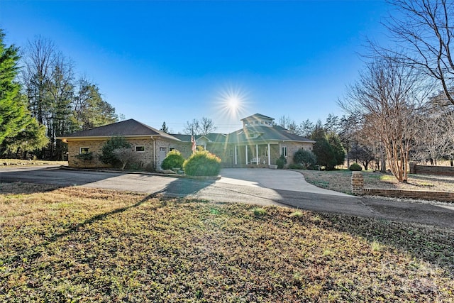 ranch-style house with a front lawn