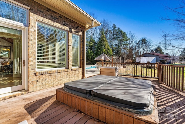 wooden deck featuring a swimming pool with hot tub