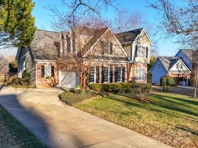 view of front of house with a garage and a front lawn