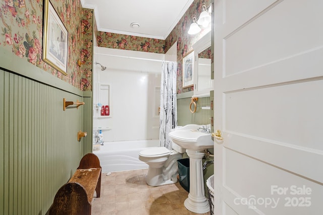 bathroom with ornamental molding, shower / bath combo, and toilet