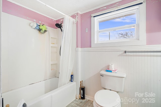 bathroom featuring shower / bath combination with curtain and toilet