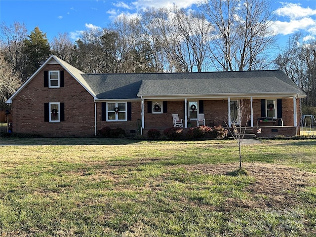 ranch-style home featuring a porch and a front lawn