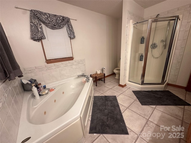 bathroom featuring a textured ceiling, separate shower and tub, tile patterned flooring, and toilet