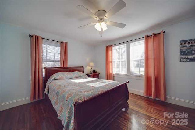 bedroom featuring ceiling fan and dark hardwood / wood-style floors