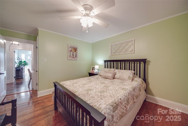 bedroom with ceiling fan, dark hardwood / wood-style floors, and ornamental molding