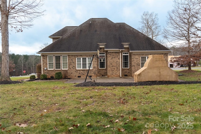 back of house with a yard and a patio area