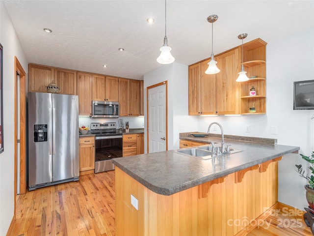1185 Mule Stomp Rd, Clyde, NC 28721 - kitchen with stainless steel appliances, dark countertops, a peninsula, open shelves, and recessed lighting