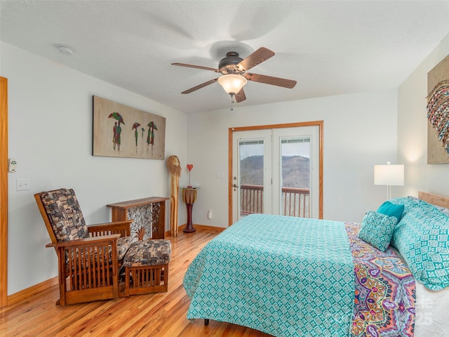 1185 Mule Stomp Rd, Clyde, NC 28721 - bedroom featuring access to outside, light wood-type flooring, and ceiling fan