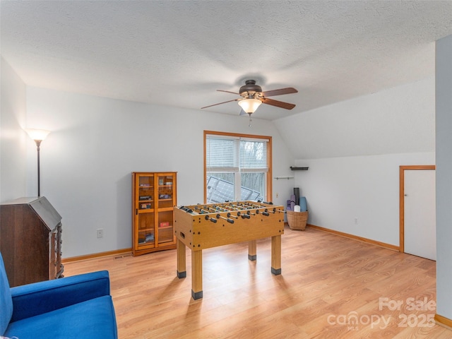 1185 Mule Stomp Rd, Clyde, NC 28721 - recreation room with a ceiling fan, light wood-style floors, a textured ceiling, and vaulted ceiling