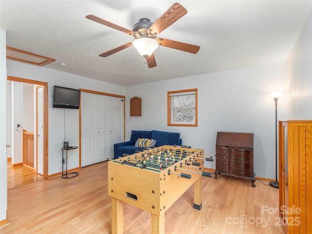 1185 Mule Stomp Rd, Clyde, NC 28721 - playroom with wood finished floors, a ceiling fan, and attic access