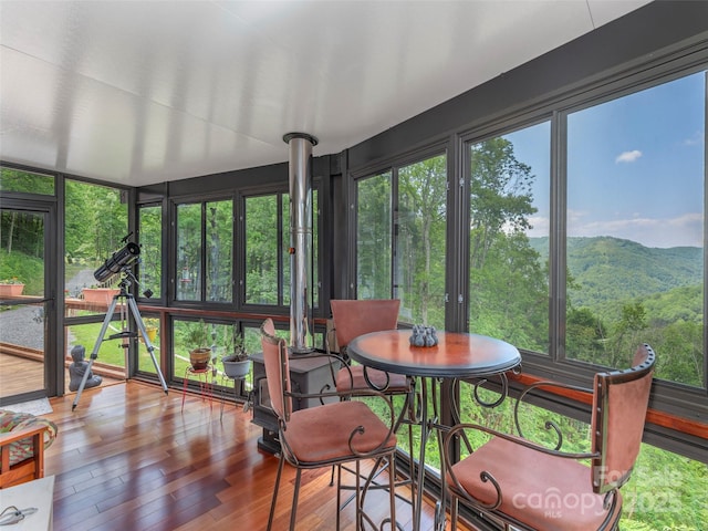 1185 Mule Stomp Rd, Clyde, NC 28721 - sunroom / solarium featuring wood finished floors and a deck with mountain view