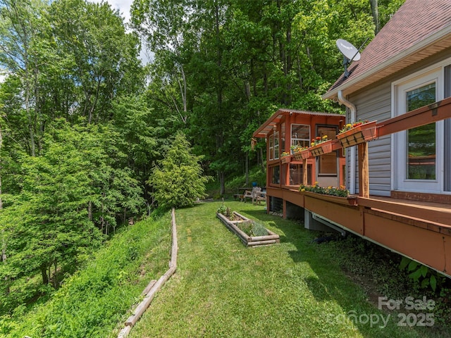 1185 Mule Stomp Rd, Clyde, NC 28721 - view of green lawn with a vegetable garden