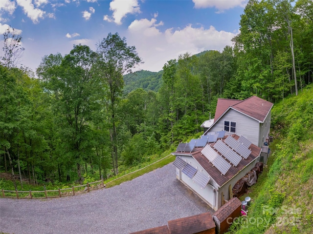 1185 Mule Stomp Rd, Clyde, NC 28721 - aerial view of property and surrounding area with a heavily wooded area