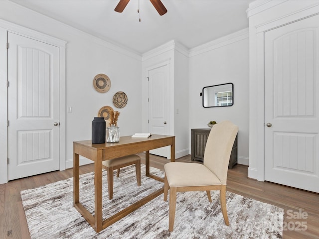 office space with ceiling fan, wood-type flooring, and ornamental molding