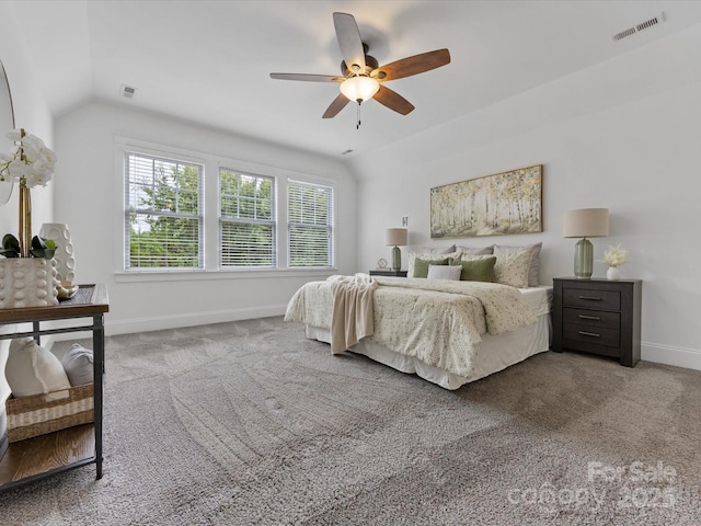 carpeted bedroom with ceiling fan and lofted ceiling