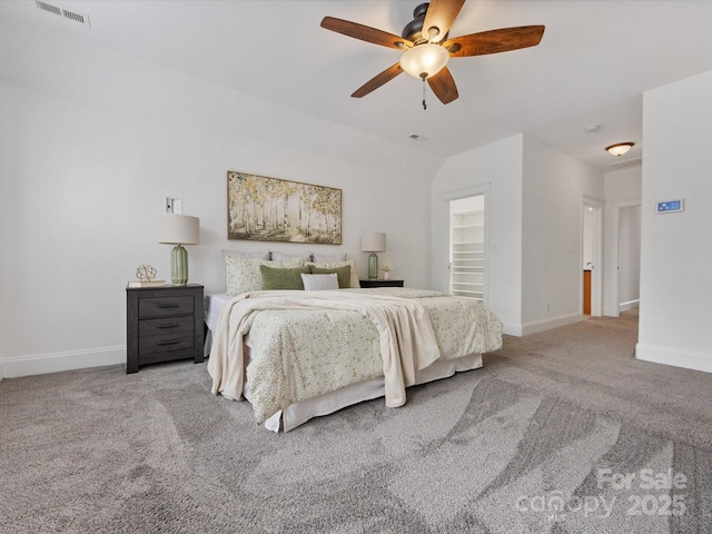 bedroom with ceiling fan and light colored carpet