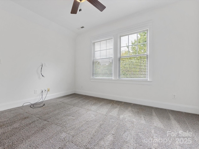 spare room featuring carpet and ceiling fan