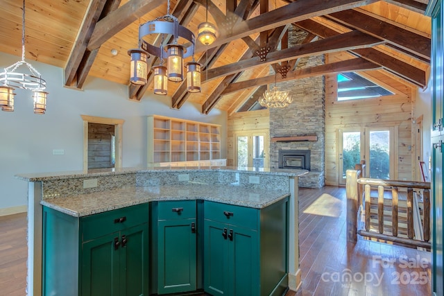 kitchen with green cabinetry, beamed ceiling, dark hardwood / wood-style floors, and high vaulted ceiling