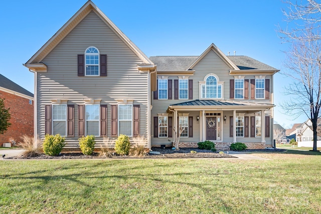 view of front of house with a front lawn and covered porch