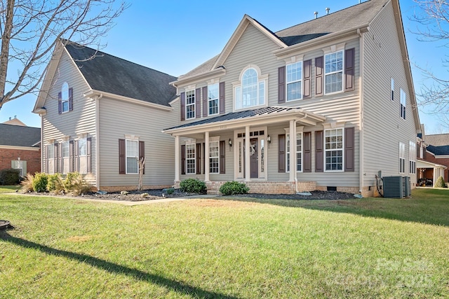 colonial inspired home featuring a porch, central air condition unit, and a front lawn