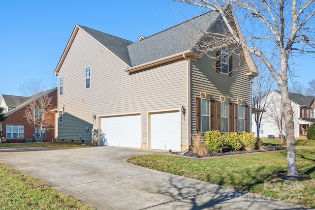 view of property exterior with a garage and a lawn