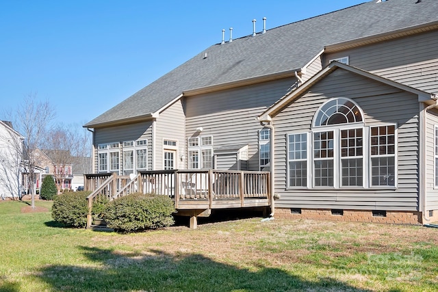 back of property featuring a yard and a wooden deck