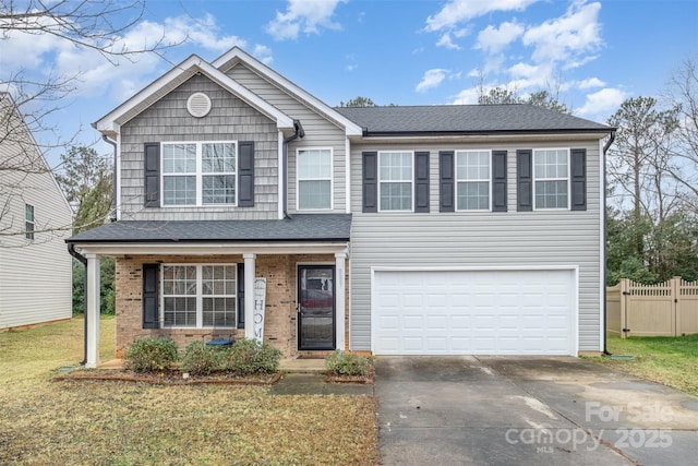 front of property featuring a front lawn and a garage