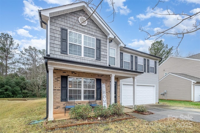 view of front of property featuring a garage and a front lawn