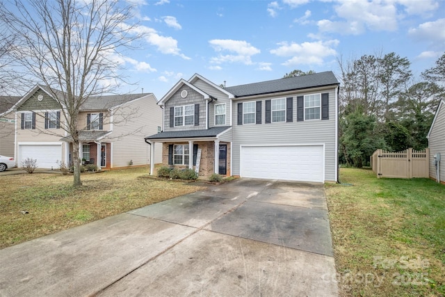 view of front of home featuring a front yard and a garage