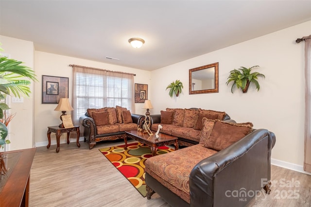 living room with light hardwood / wood-style floors