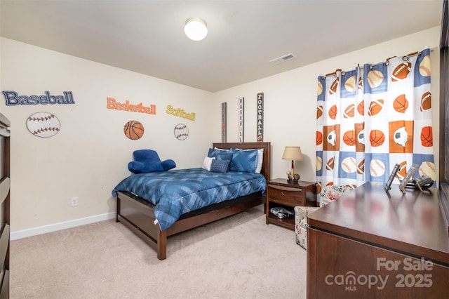 bedroom with light colored carpet