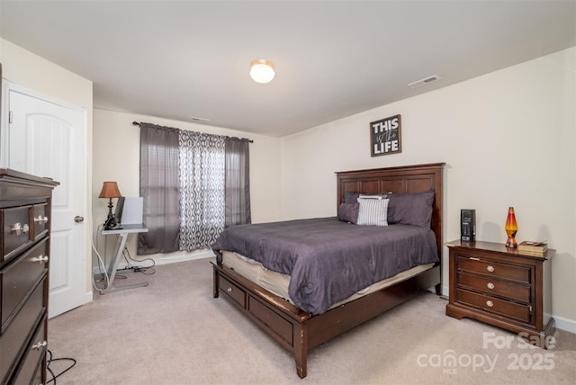 bedroom with light colored carpet