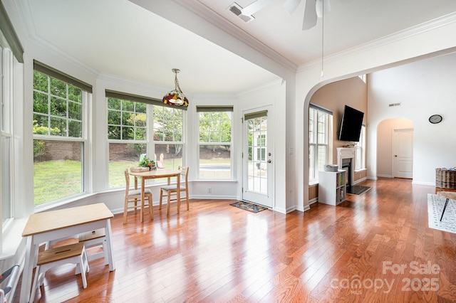 sunroom / solarium with ceiling fan