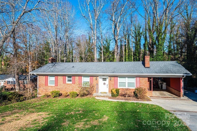 ranch-style home with a front lawn and a carport