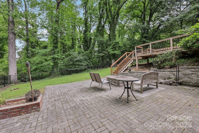 132 30th Ave NW, Hickory, NC 28601 - view of patio featuring stairway, a fire pit, and a wooden deck