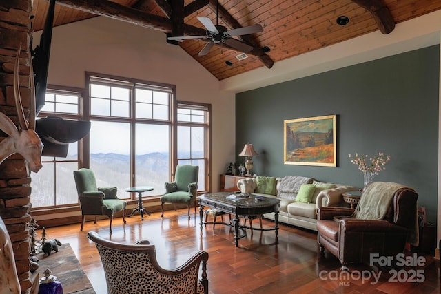 living room featuring wood-type flooring, a mountain view, wooden ceiling, and beam ceiling