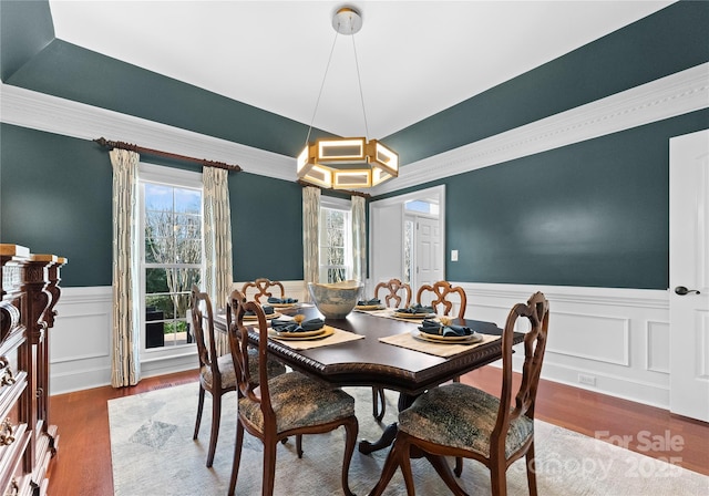 dining room with hardwood / wood-style flooring