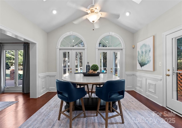 dining area with french doors, dark hardwood / wood-style floors, vaulted ceiling, and ceiling fan