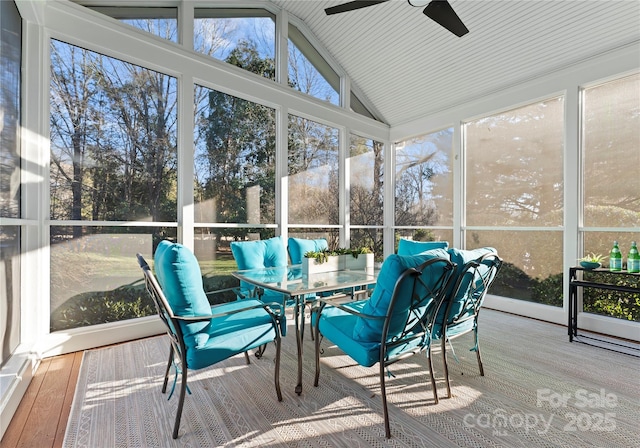 sunroom with ceiling fan and lofted ceiling