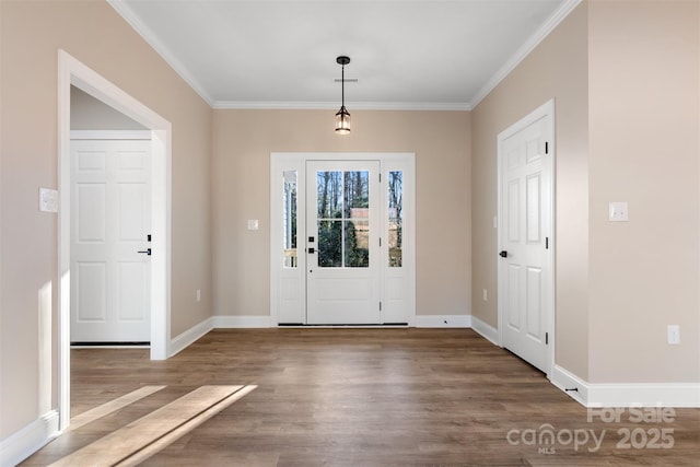 entrance foyer featuring dark hardwood / wood-style floors and crown molding