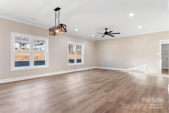 interior space featuring hardwood / wood-style floors, ceiling fan, and crown molding