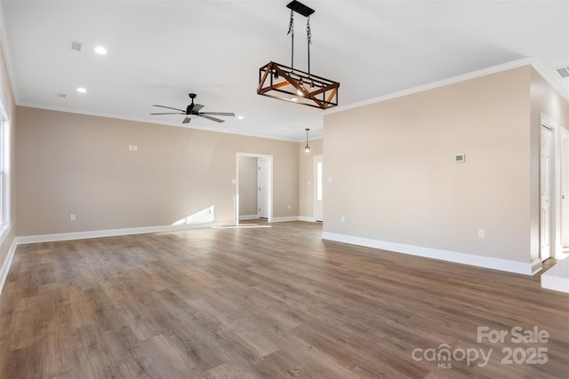 unfurnished living room with wood-type flooring, ceiling fan, and ornamental molding