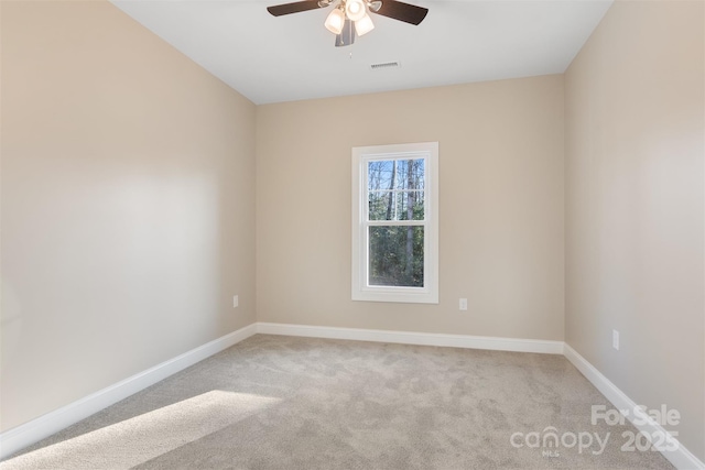 unfurnished room featuring ceiling fan and light colored carpet