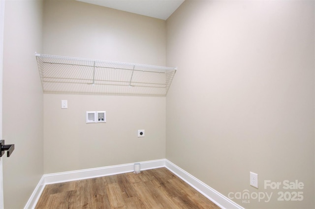 washroom with hookup for a washing machine, hardwood / wood-style flooring, and electric dryer hookup