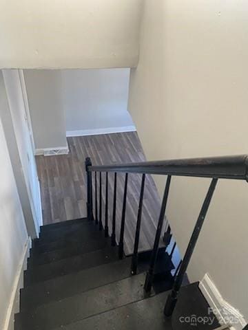 stairs with wood-type flooring